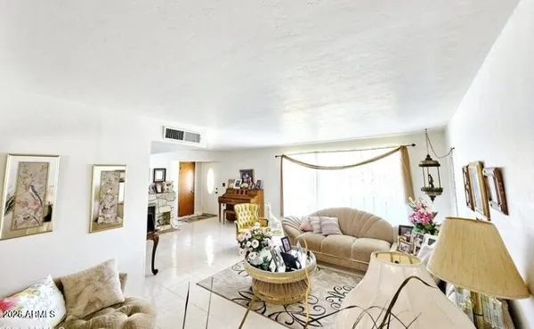 a living room with furniture and a table