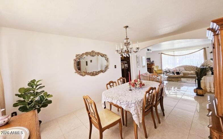 2201 East 7th Street Douglas, AZ 85607 - Photo 14 of 49 a view of a dining room with furniture and a chandelier