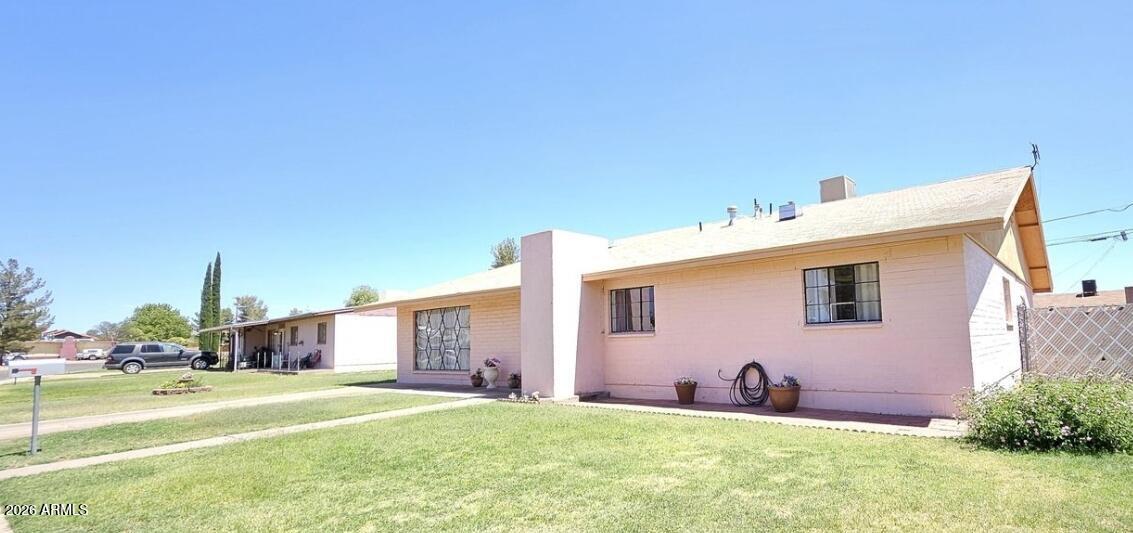2201 East 7th Street Douglas, AZ 85607 - Photo 2 of 49 a bathroom with a sink and a yard