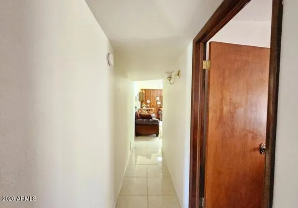 a bedroom with two beds and a window