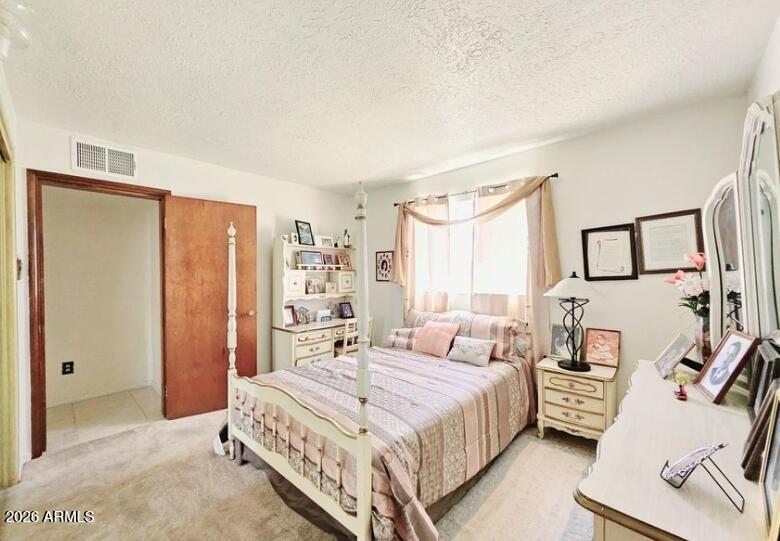 2201 East 7th Street Douglas, AZ 85607 - Photo 36 of 49 a bedroom with a large bed and a window