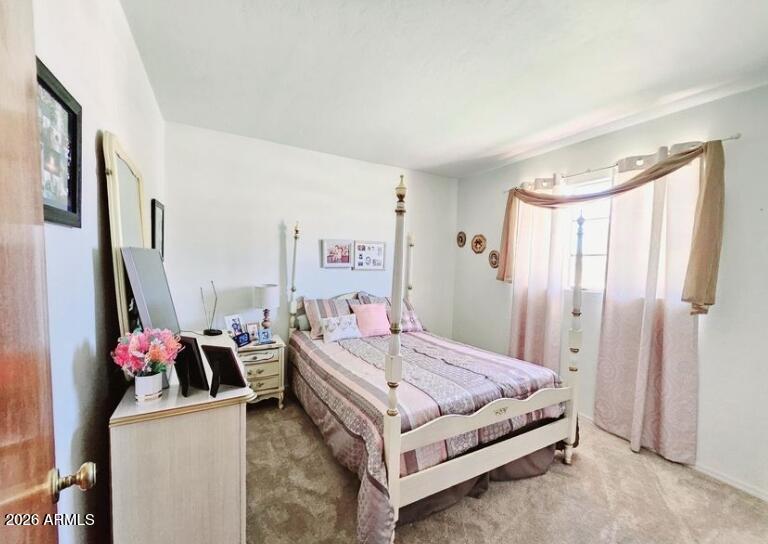 2201 East 7th Street Douglas, AZ 85607 - Photo 37 of 49 a bedroom with a bed and a flat screen tv