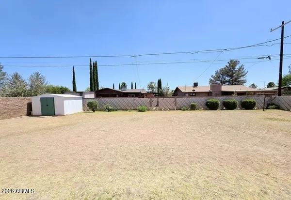 a view of a backyard of the house