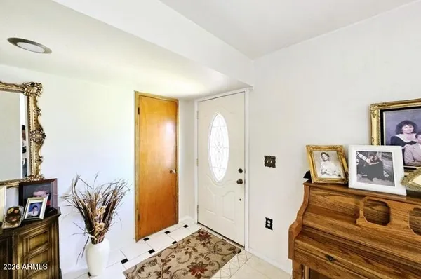 a bedroom with furniture and a window