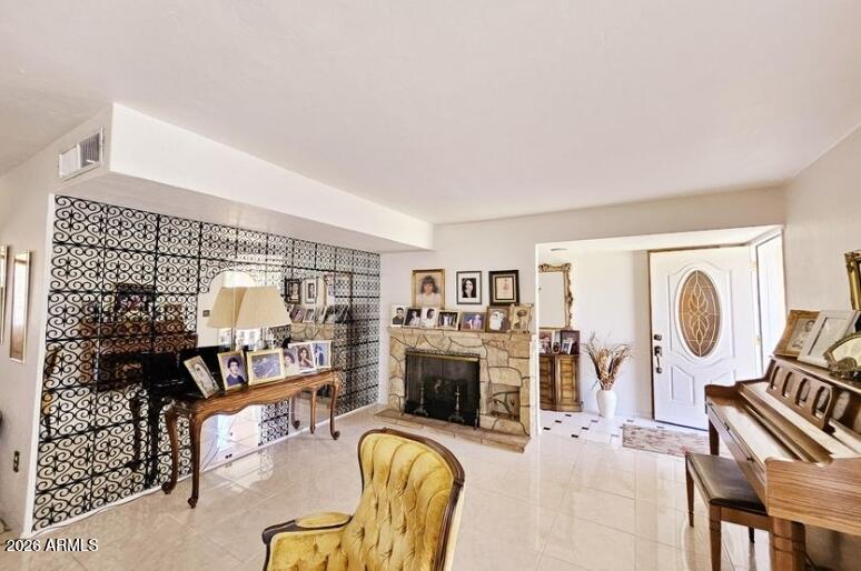 2201 East 7th Street Douglas, AZ 85607 - Photo 8 of 49 a living room with furniture a flat screen tv and a fireplace