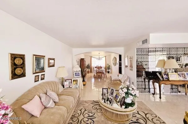 a living room with furniture and a large window