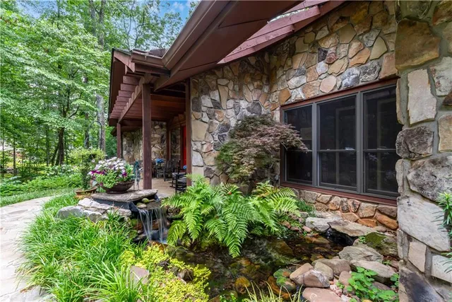 a outdoor space with a large window and furniture