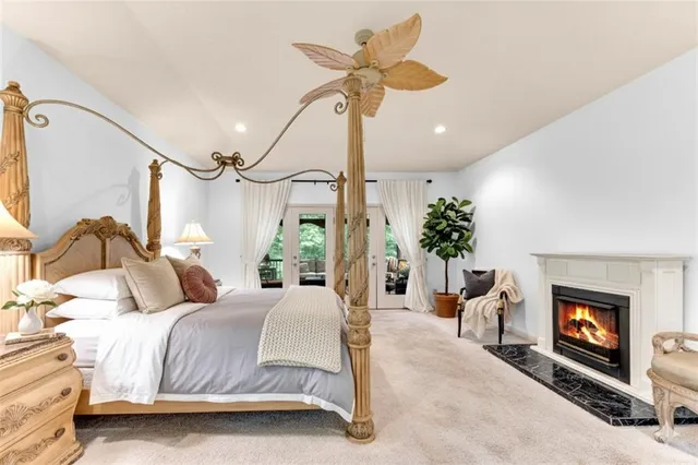 a view of a porch with furniture and a yard