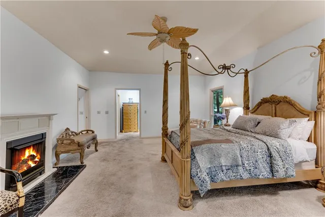a living room with patio furniture and a floor to ceiling window