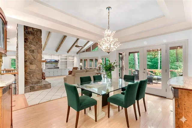 a kitchen with stainless steel appliances a stove a sink cabinets and a refrigerator