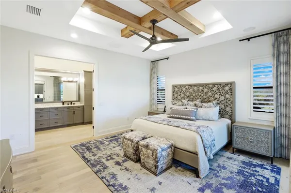 a bedroom with a large bed and a couch
