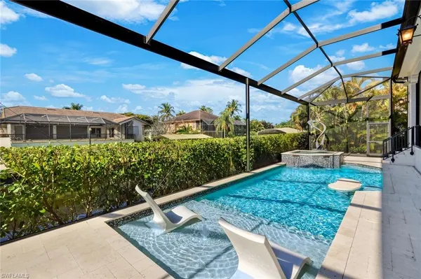 a view of a backyard with sitting area