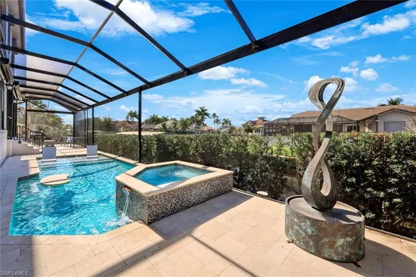 a view of swimming pool with a patio