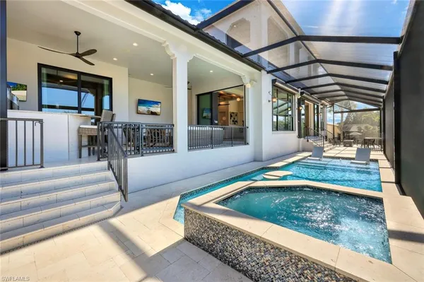 a swimming pool with outdoor seating