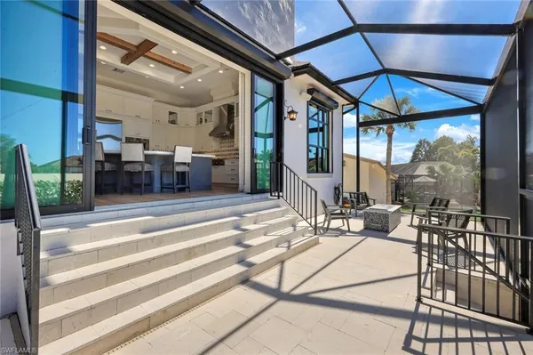 a patio outdoor space with patio furniture and garden view