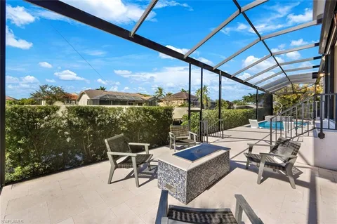 a view of a patio with a table chairs and a table