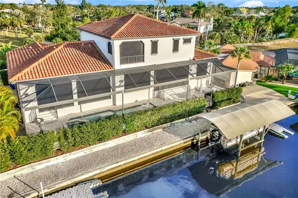 an aerial view of a house with a yard