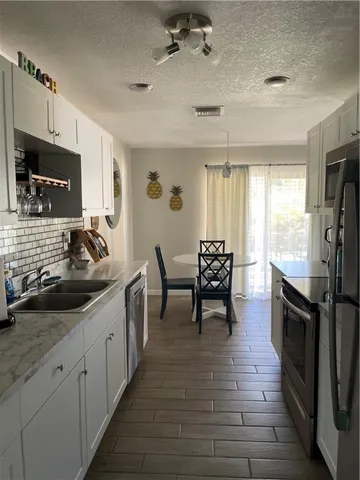 a kitchen with sink cabinets and counter space
