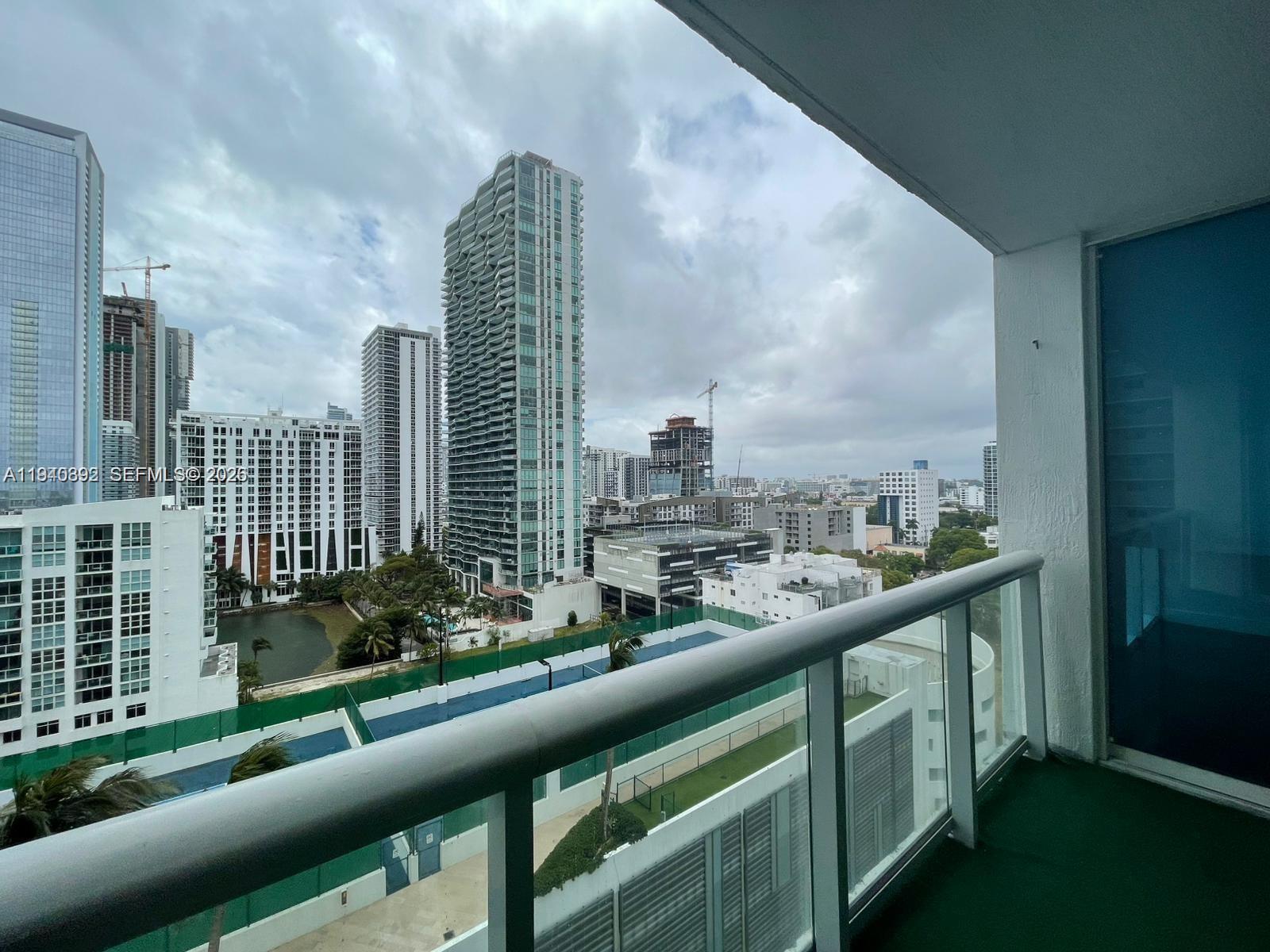 480 Northeast 30th Street, Unit 1403 Miami, FL 33137 - Photo 2 of 30 a view of city from a balcony