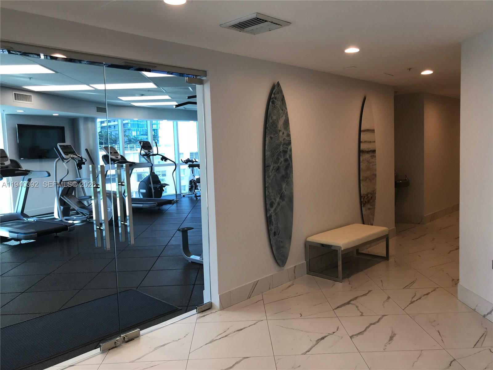 480 Northeast 30th Street, Unit 1403 Miami, FL 33137 - Photo 29 of 30 a view of a room with gym equipment