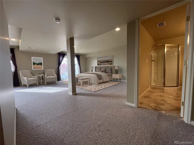 a view of hallway with livingroom and furniture