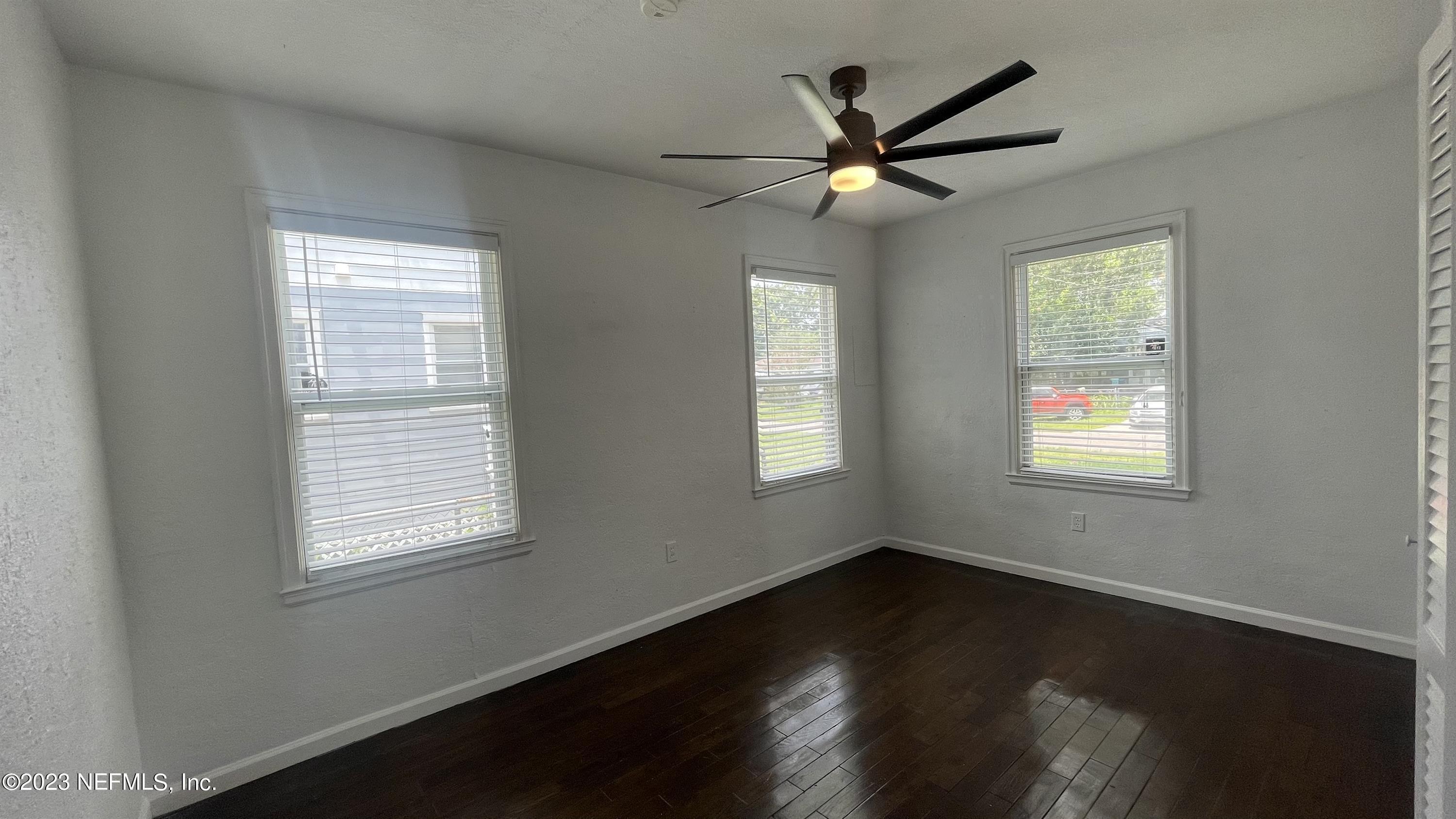 5228 Sunderland Road Jacksonville, FL 32210 - Photo 11 of 18 a view of a livingroom with a ceiling fan and window