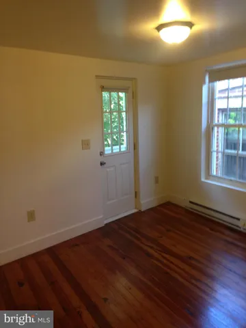 a view of gallery with wooden floor