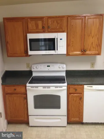 a kitchen with a stove and a microwave