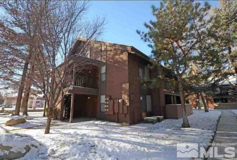 1465 East Peckham Lane, Unit 57 Reno, NV 89502 - Photo 1 of 1 a view of a house with a yard