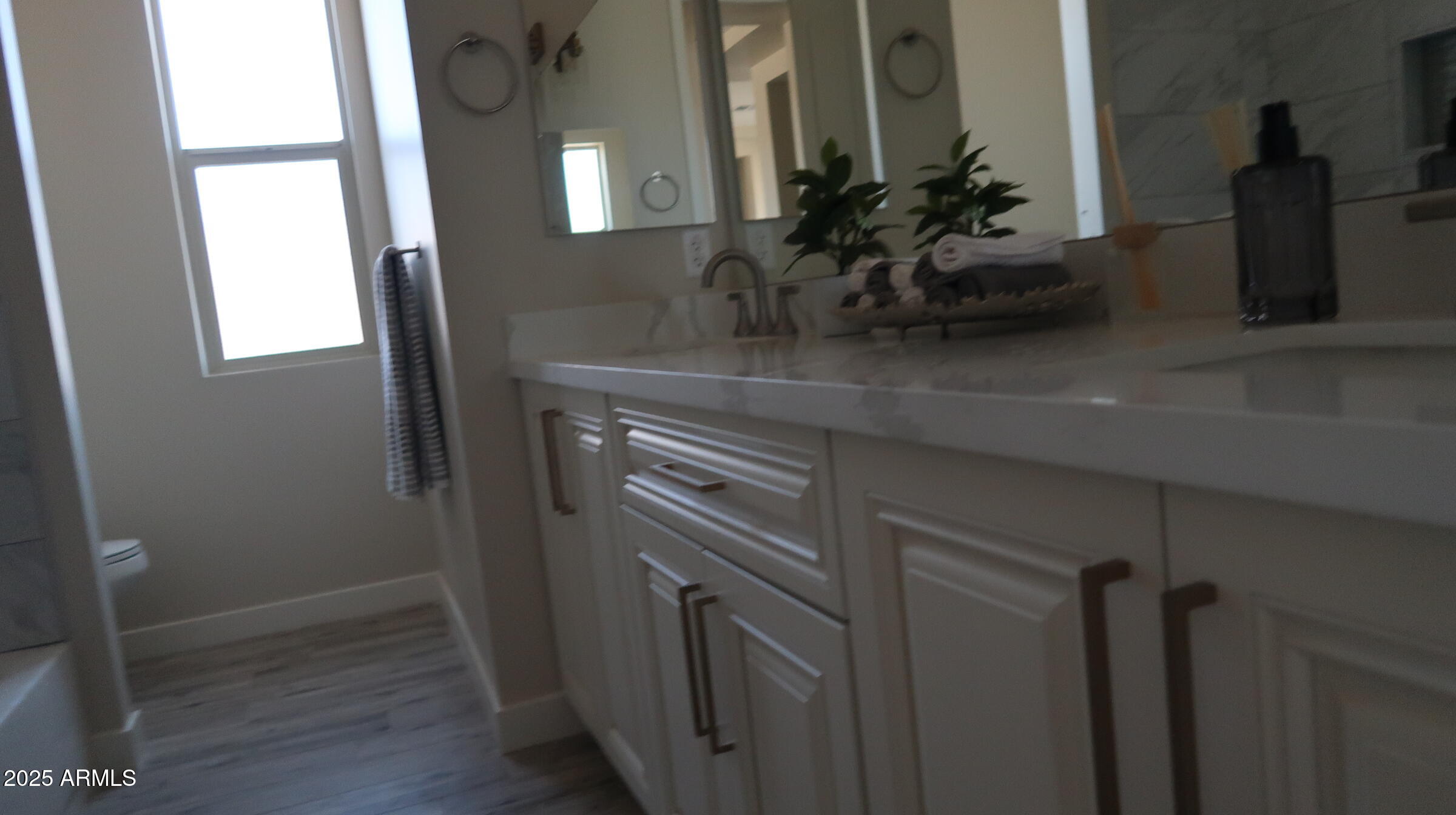 23131 West Skinner Road Wittmann, AZ 85361 - Photo 11 of 13 a kitchen with a sink and a mirror