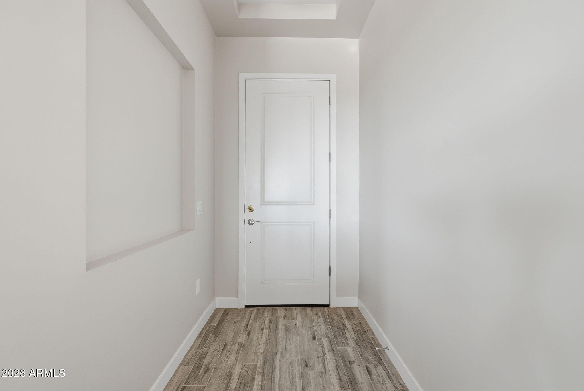 23131 West Skinner Road Wittmann, AZ 85361 - Photo 19 of 48 a view of a small space with wooden floor and closet