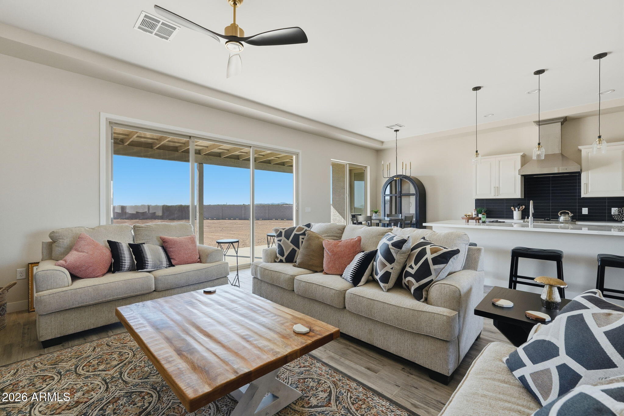 23131 West Skinner Road Wittmann, AZ 85361 - Photo 20 of 48 a living room with furniture ceiling fan and a rug