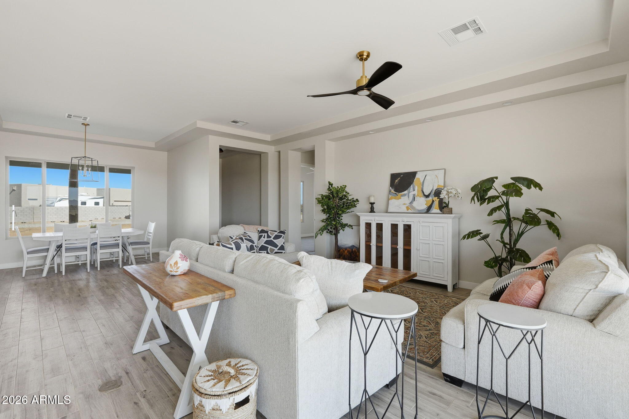 23131 West Skinner Road Wittmann, AZ 85361 - Photo 22 of 48 a living room with furniture and a wooden floor