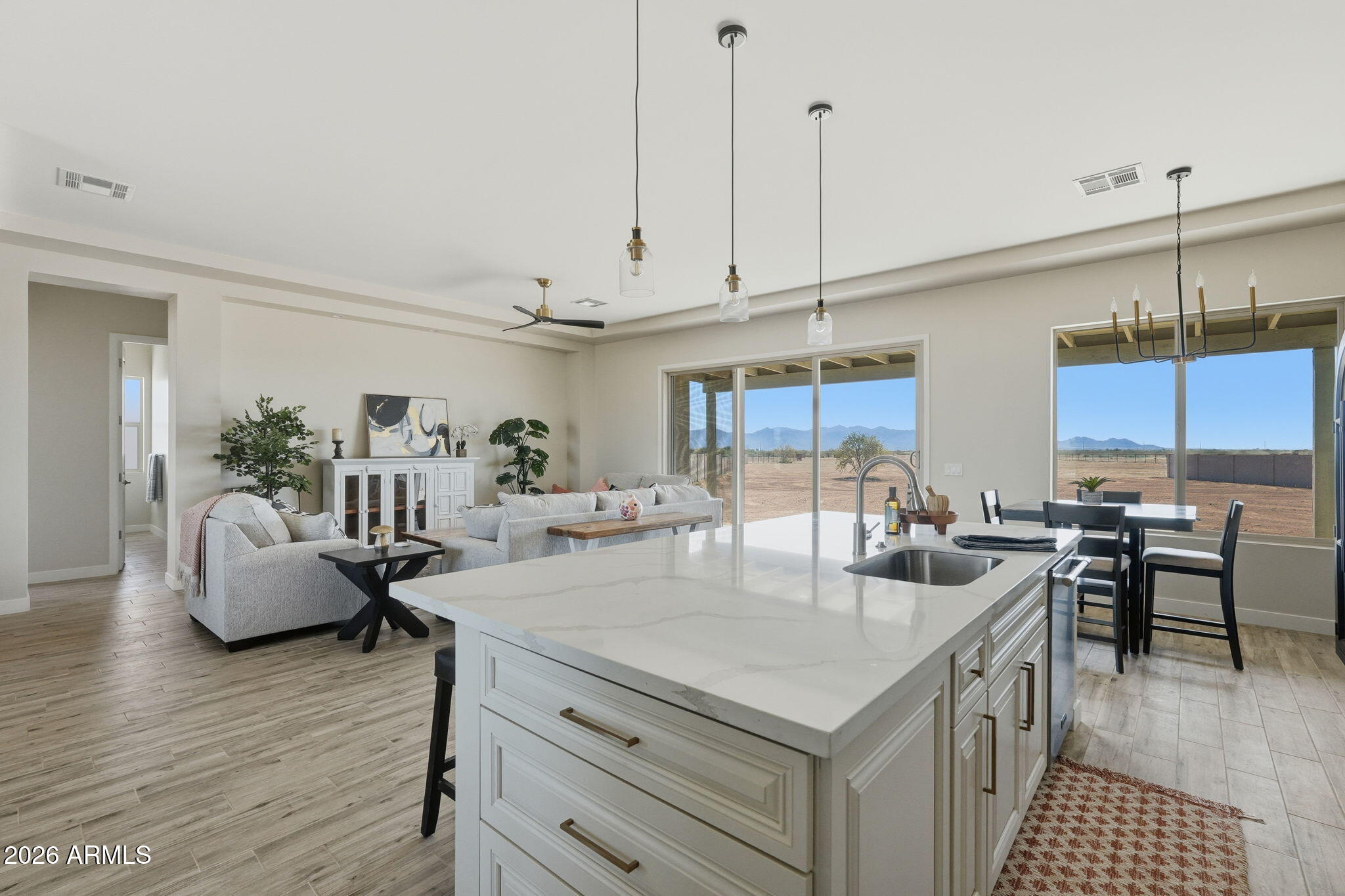 23131 West Skinner Road Wittmann, AZ 85361 - Photo 29 of 48 a kitchen with granite countertop a table and chairs