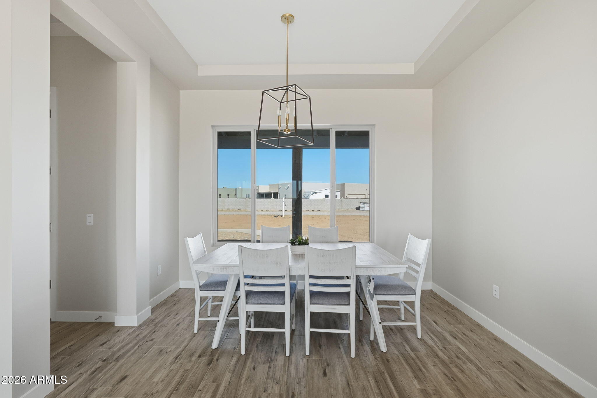 23131 West Skinner Road Wittmann, AZ 85361 - Photo 31 of 48 a view of a dining room with furniture window and wooden floor