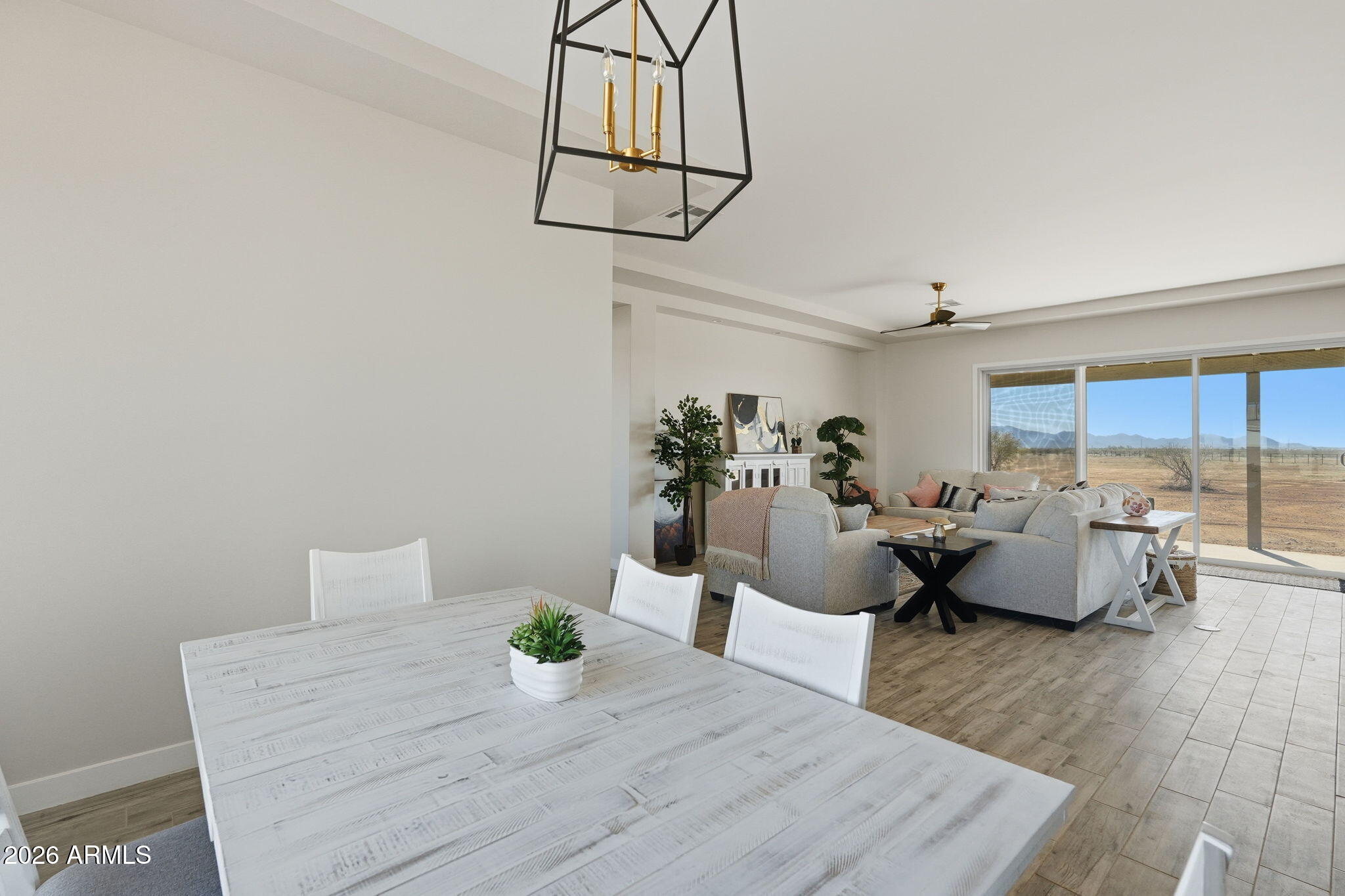 23131 West Skinner Road Wittmann, AZ 85361 - Photo 32 of 48 a living room with furniture and wooden floor