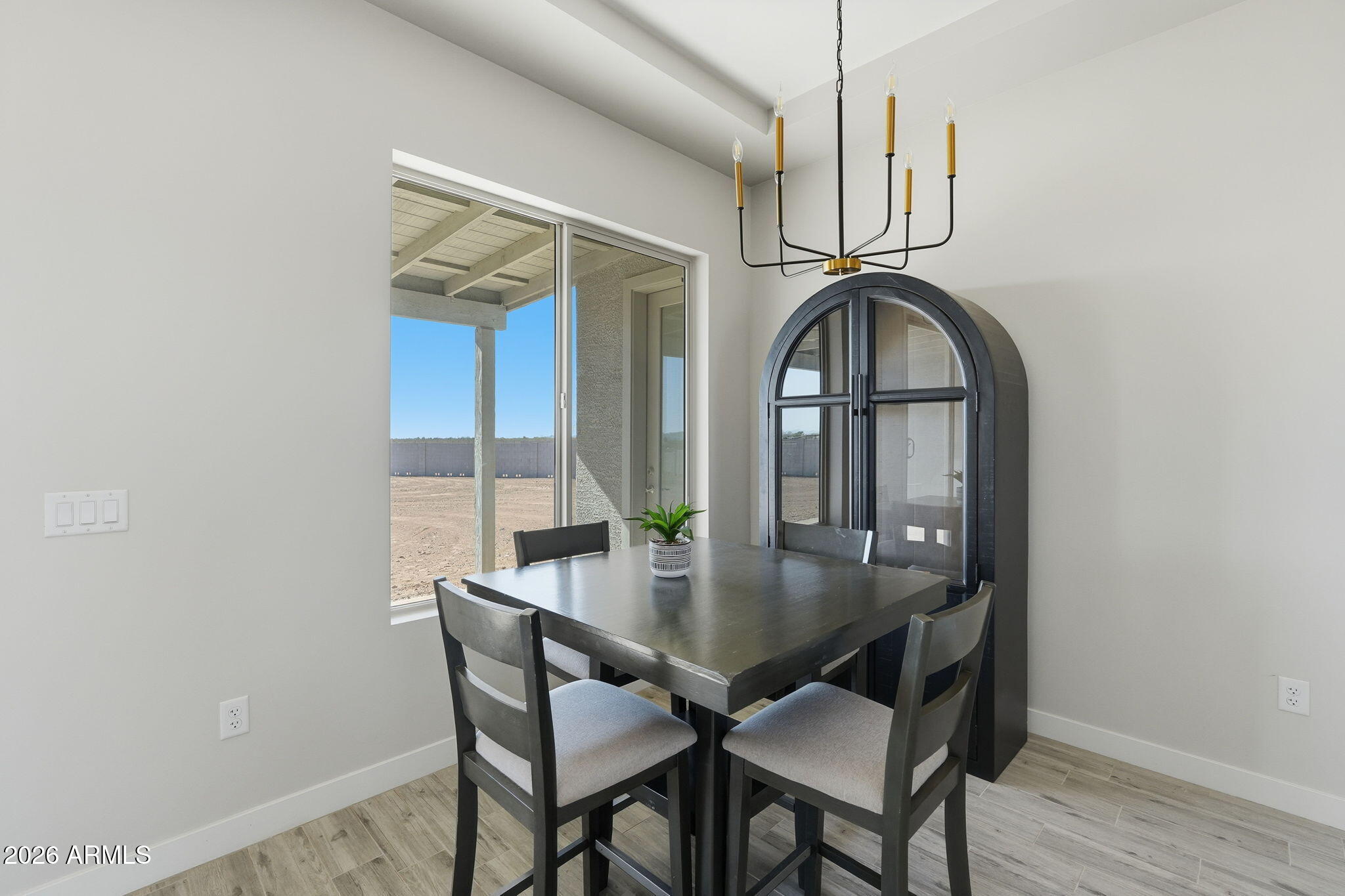 23131 West Skinner Road Wittmann, AZ 85361 - Photo 33 of 48 a view of a dining room with furniture window and wooden floor