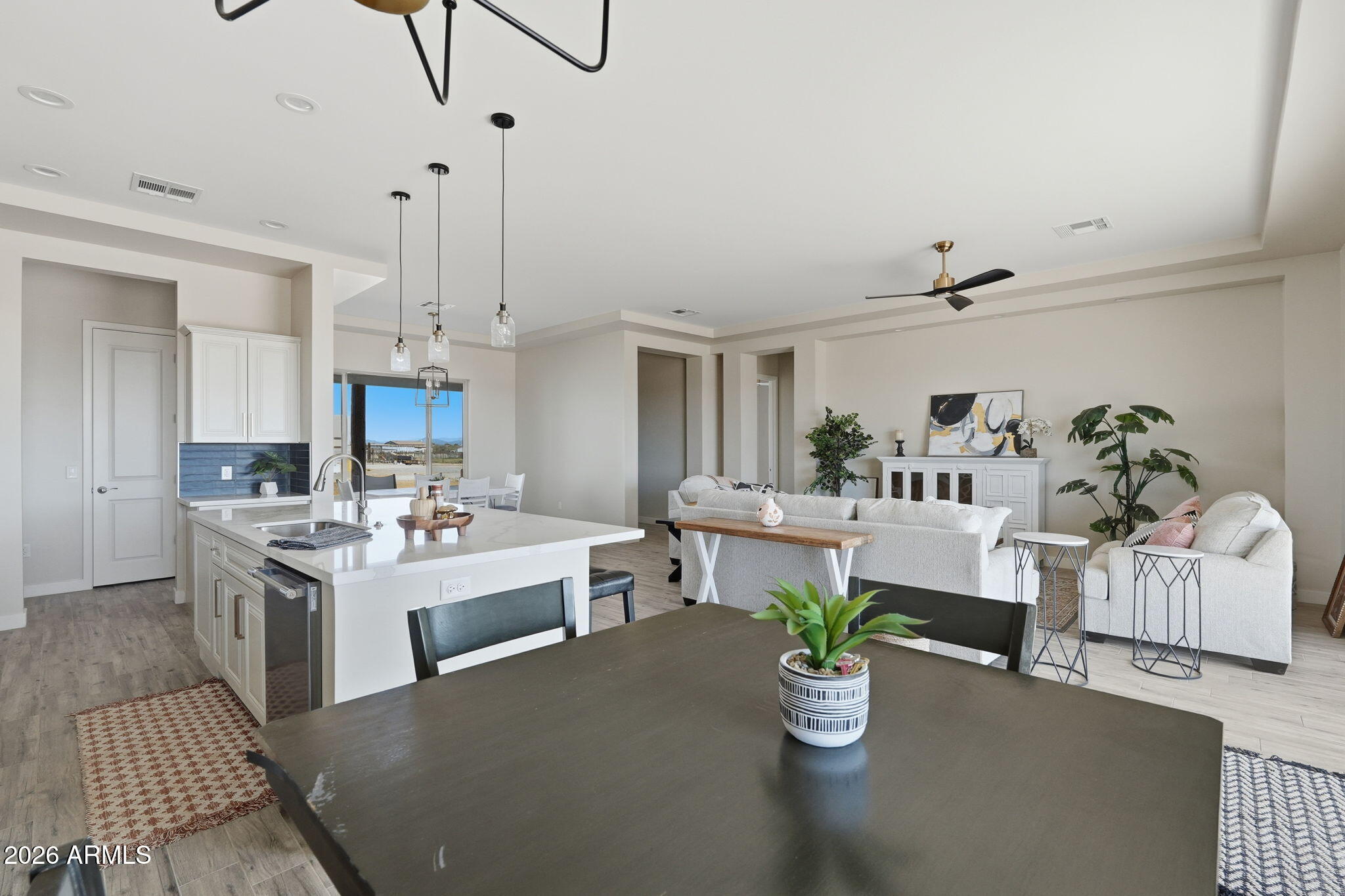 23131 West Skinner Road Wittmann, AZ 85361 - Photo 34 of 48 a living room with furniture and kitchen view