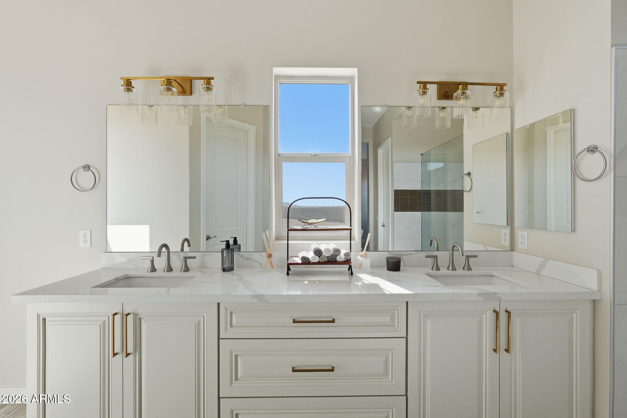 23131 West Skinner Road Wittmann, AZ 85361 - Photo 35 of 48 a bathroom with double vanity sink and a mirror