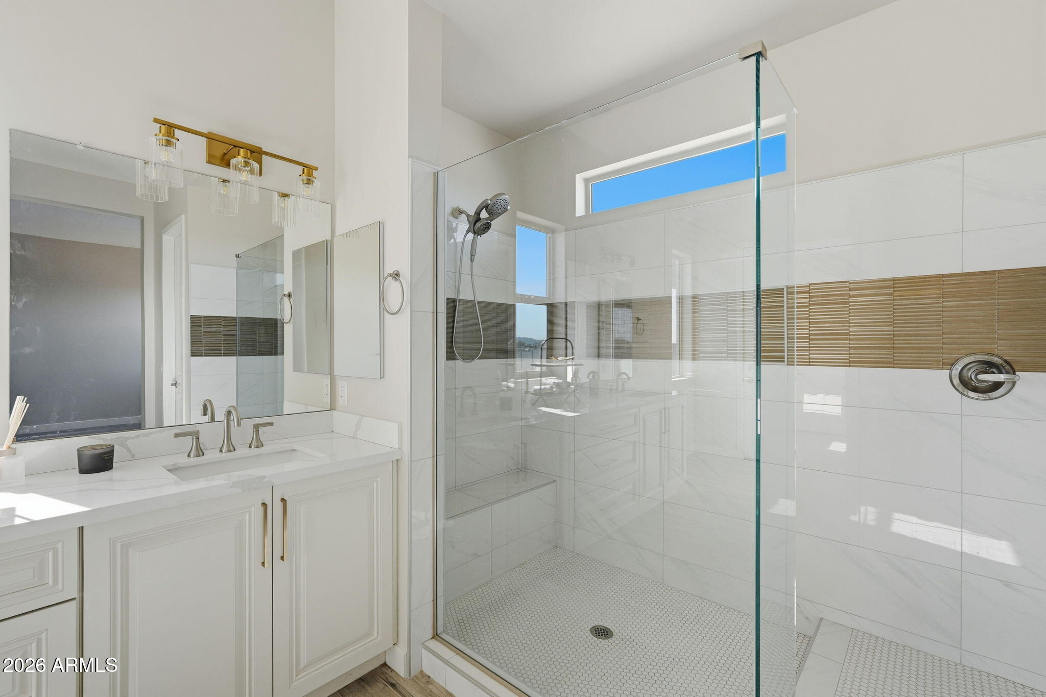 23131 West Skinner Road Wittmann, AZ 85361 - Photo 36 of 48 a bathroom with a shower sink and mirror