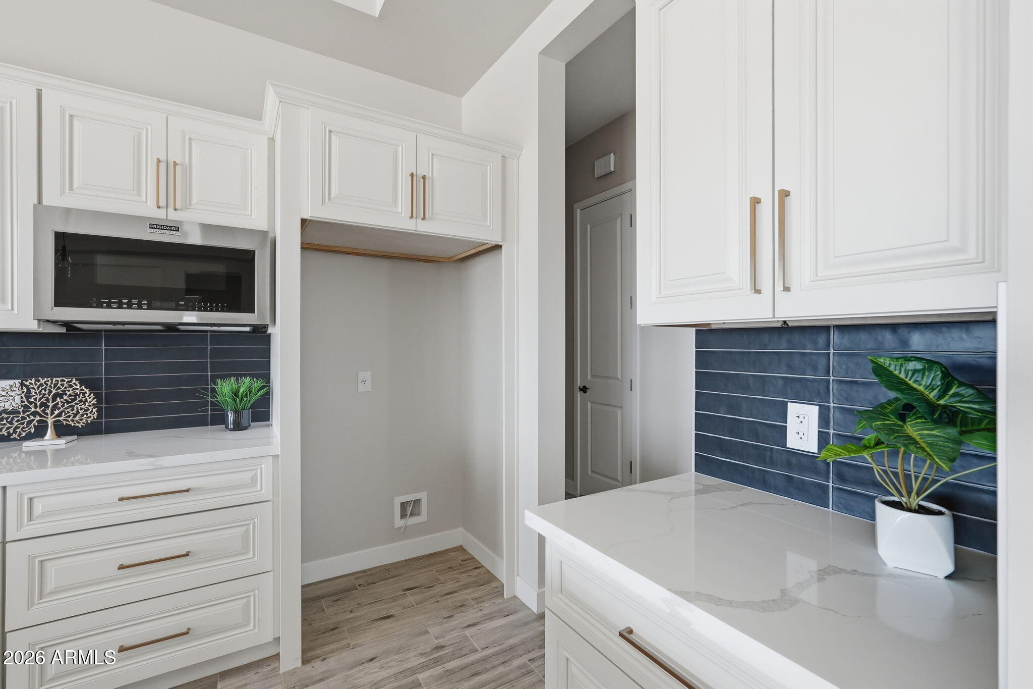 23131 West Skinner Road Wittmann, AZ 85361 - Photo 39 of 48 a kitchen with a sink and a microwave