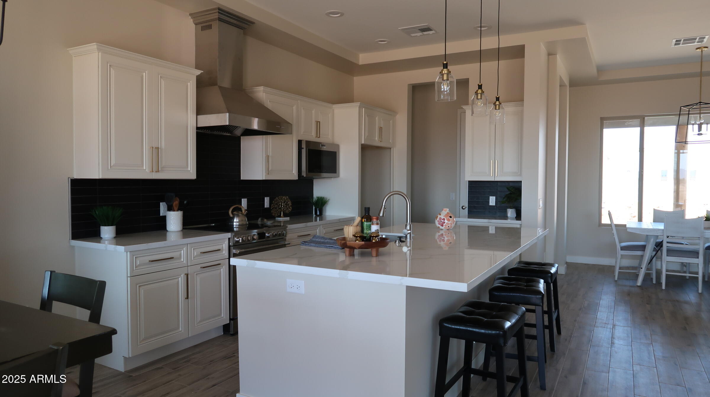 23131 West Skinner Road Wittmann, AZ 85361 - Photo 6 of 13 a kitchen with a sink stove and cabinets