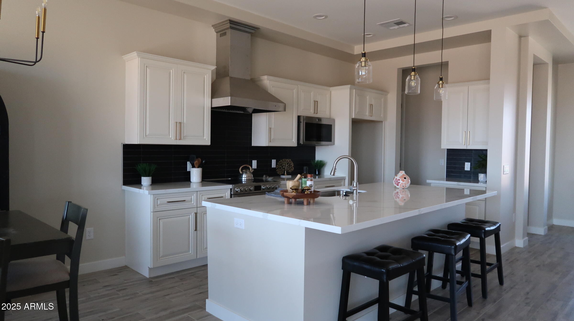 23131 West Skinner Road Wittmann, AZ 85361 - Photo 7 of 13 a kitchen with appliances a sink and cabinets