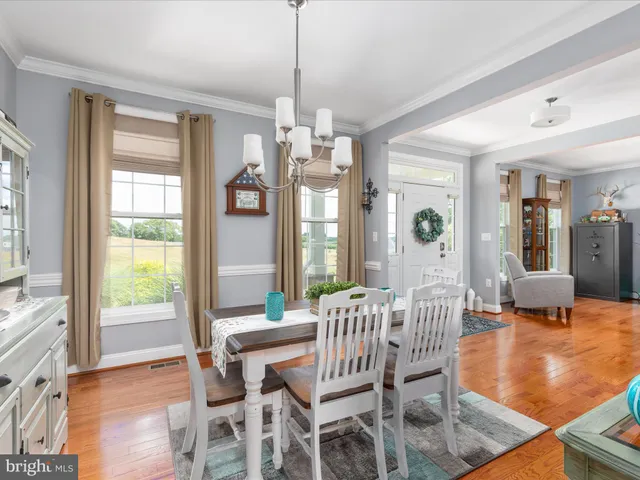 a kitchen with granite countertop white cabinets and a sink
