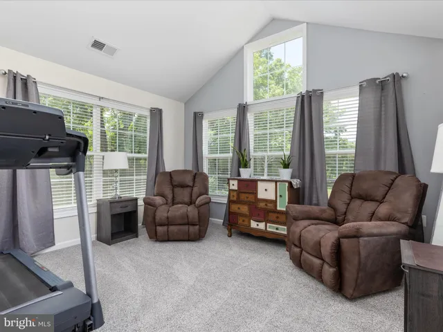 a view of a chair and table in the garden