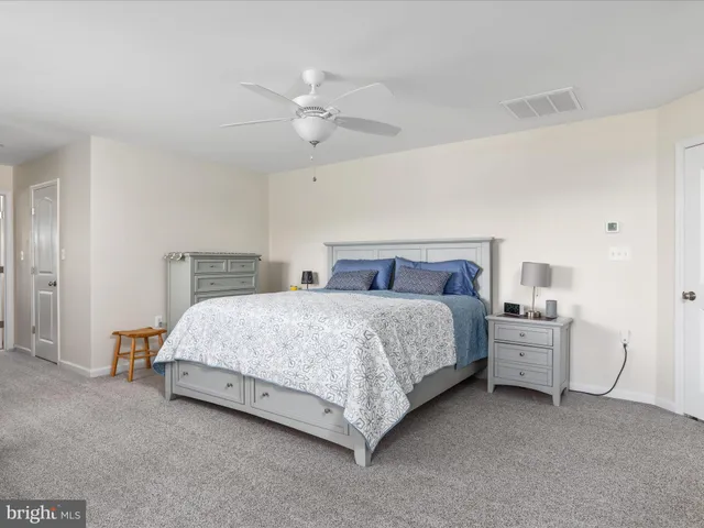 a front view of a house with swimming pool and glass windows