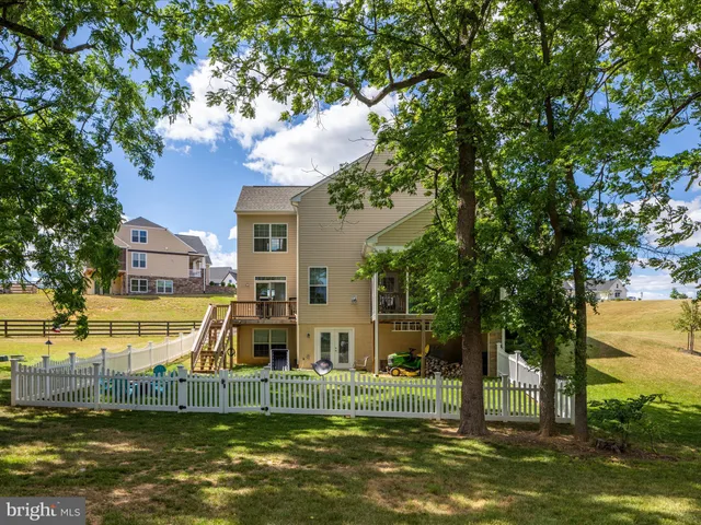 a view of a lake with a house in the background