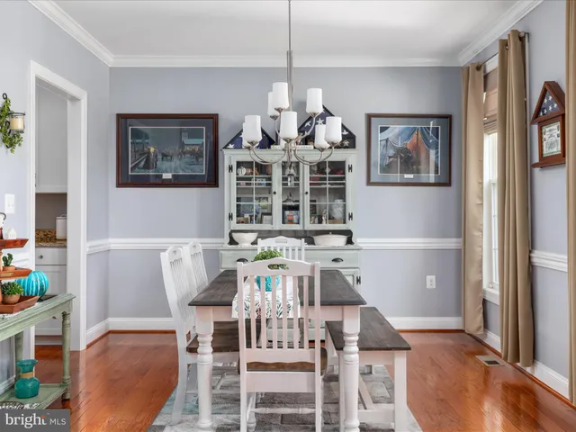 a kitchen with stainless steel appliances granite countertop a sink and a stove