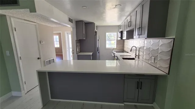 a view of a kitchen from a dining room