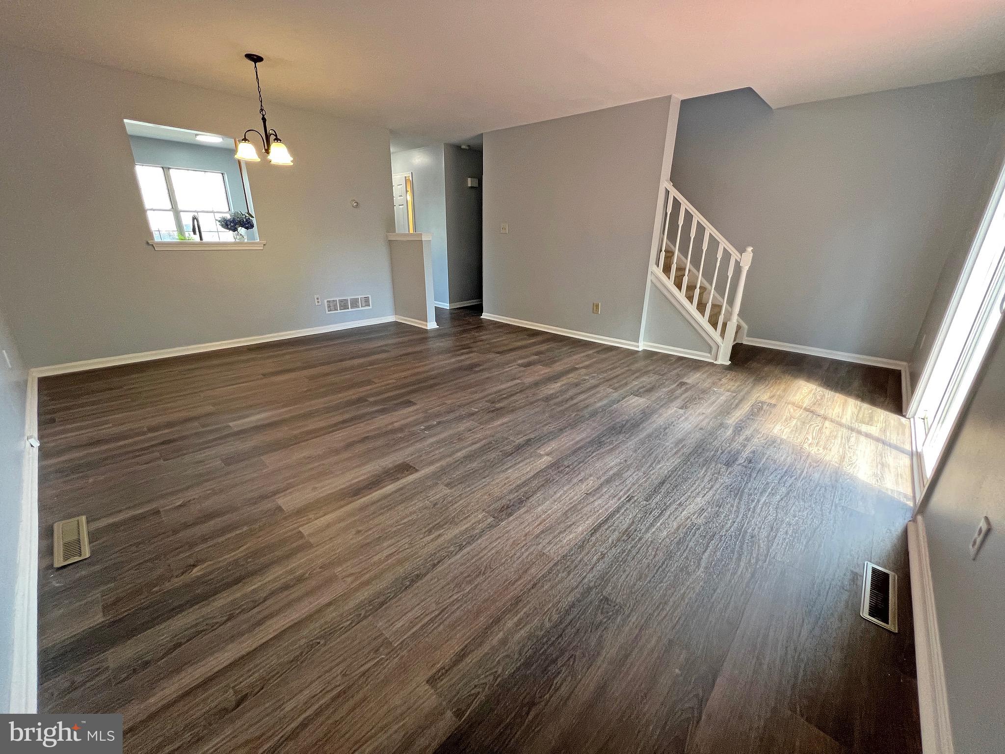 1049 Old Forge Road New Castle, DE 19720 - Photo 9 of 27 Living & Dining Room with new floors and paint